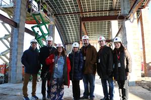 Board Trustees and Superintendent pose inside new security vestibule 